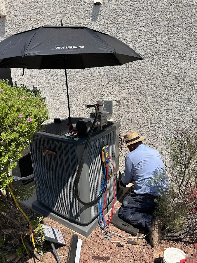 HVAC technician performing outdoor AC maintenance in Mill Creek